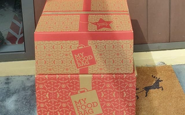 Sustainable Celebration Tips for this Silly Season 2 My Food Bag Christmas boxes outside a foodie's door. Made from sustainable sources.