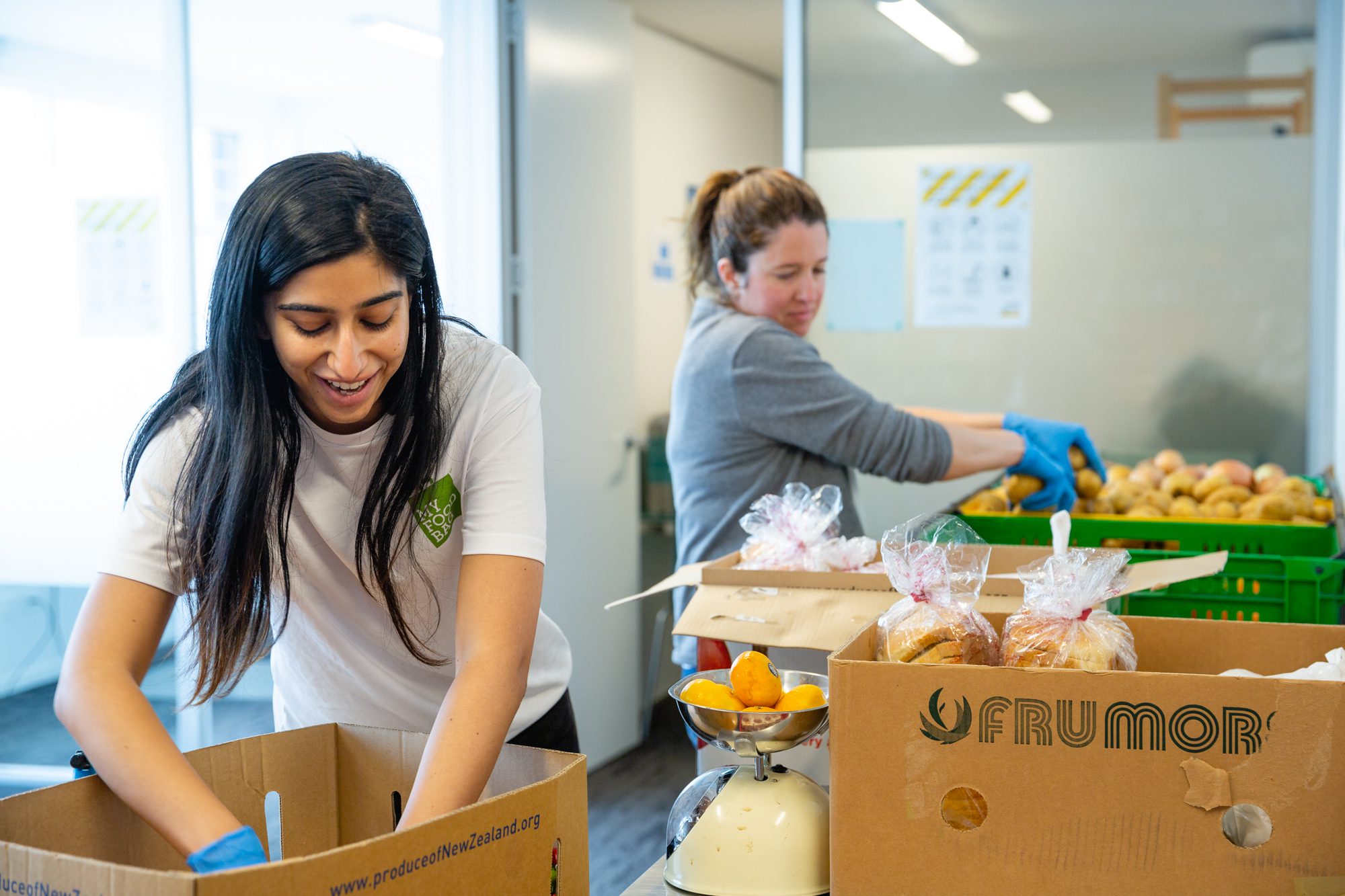 A team from My Food Bag volunteer at Auckland City Mission box packing.