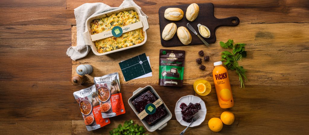 A Vegetarian Care Package including mac & cheese, soups, garlic rolls, chocolate pudding, juice and peppermint creams.