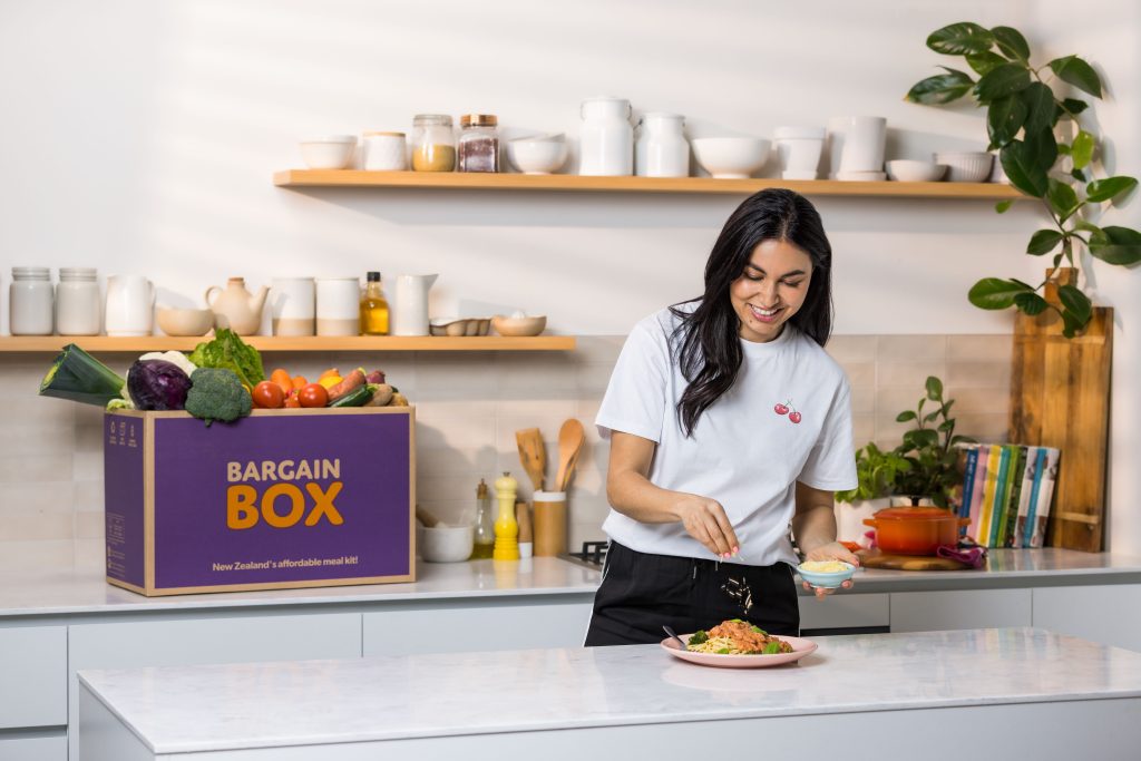 What is the Best Meal Kit in New Zealand? The Ultimate Guide 2 Nadia Lim with a Bargain Box meal kit box in a kitchen.